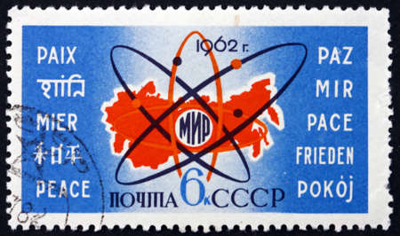 RUSSIA - CIRCA 1962: a stamp printed in the Russia shows Map of Russia, Atom Symbol and Word Peace...
