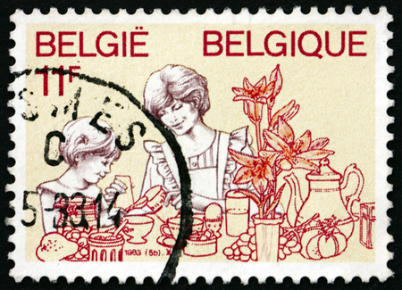 BELGIUM - CIRCA 1983: a stamp printed in the Belgium shows Homemaker, Homage to Women, circa 1983のeditorial素材