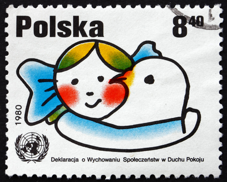 POLAND - CIRCA 1980: a stamp printed in Poland shows Girl Embracing Dove, UN Declaration on the Preparation of Societies for Life in Peace, circa 1980のeditorial素材