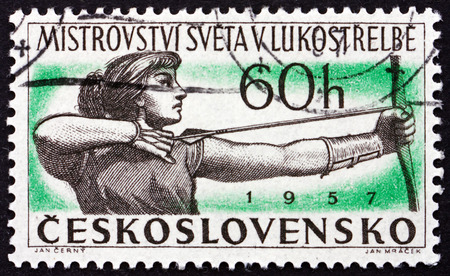 CZECHOSLOVAKIA - CIRCA 1945: a stamp printed in Czechoslovakia shows Woman Archer, International Archery Championships, circa 1945のeditorial素材