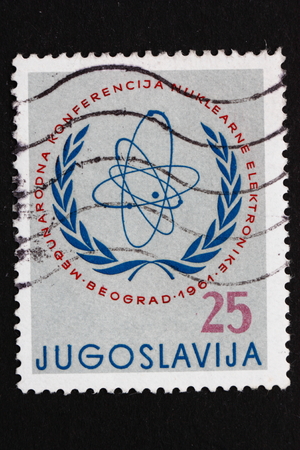 YUGOSLAVIA - CIRCA 1961: a stamp printed in Yugoslavia shows International Atomic Commission Emblem, International Nuclear Electronic Conference, Belgrade, circa 1961のeditorial素材