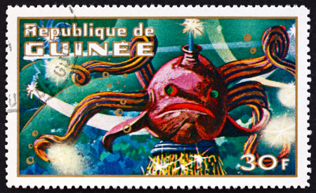 GUINEA - CIRCA 1972: a stamp printed in Guinea shows Imaginary Prehistoric Space Creature, circa 1972のeditorial素材