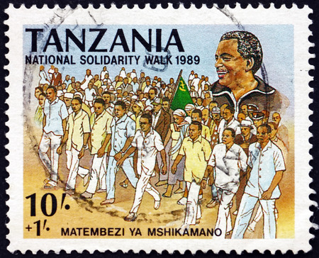 TANZANIA - CIRCA 1989: a stamp printed in Tanzania dedicated to National solidarity walk, president Ali Hassan Mwinyi, circa 1989のeditorial素材