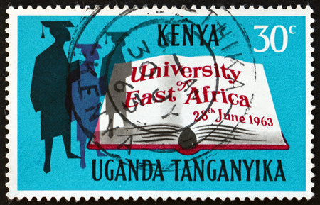 EAST AFRICAN POSTAL UNION - CIRCA 1963: a stamp printed in East African Postal Union (Kenya, Uganda, Tanganyika) shows Scholars and open book, circa 1963のeditorial素材