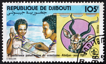DJIBOUTI - CIRCA 1981: a stamp printed in the Djibouti shows Scout giving sign, Pan-African scouting conference, Abidjan, circa 1981のeditorial素材