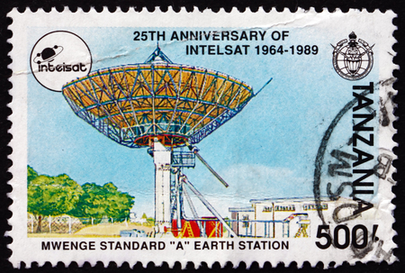 TANZANIA - CIRCA 1991: a stamp printed in Tanzania shows Mwenge standard A Earth station, 25th anniversary of Intelsat, circa 1991のeditorial素材