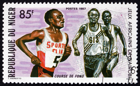 NIGER - CIRCA 1987: a stamp printed in Niger shows Runners, African Games, Nairobi, circa 1987のeditorial素材