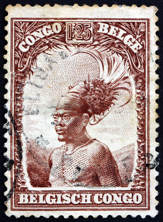 BELGIAN CONGO - CIRCA 1931: a stamp printed in Belgian Congo shows Mangbetu chief, circa 1931のeditorial素材