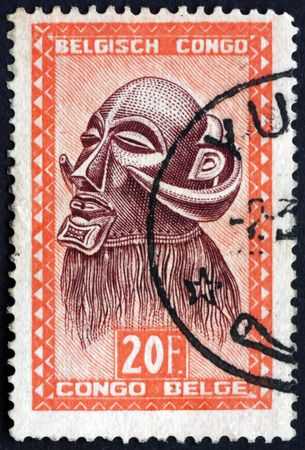 BELGIAN CONGO - CIRCA 1948: a stamp printed in Belgian Congo shows Mbowa, executioner's mask with buffalo horns, Baluba tribe, circa 1948のeditorial素材