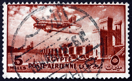 EGYPT - CIRCA 1953: a stamp printed in Egypt shows Delta Dam and DC-3 Plane, circa 1953のeditorial素材