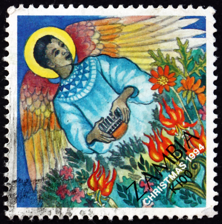 ZAMBIA - CIRCA 1995: a stamp printed in Zambia shows Christmas Angel, circa 1995のeditorial素材
