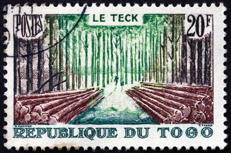 TOGO - CIRCA 1957: a stamp printed in Togo shows Teak Forest, circa 1957のeditorial素材