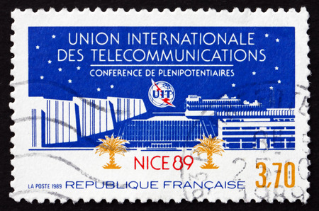 FRANCE - CIRCA 1989: a stamp printed in France dedicated to ITU plenipotentiaries conference, Nice, circa 1989のeditorial素材