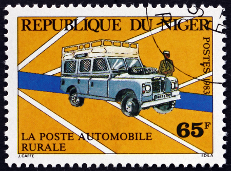 NIGER - CIRCA 1983: a stamp printed in Niger shows Mail Van, circa 1983のeditorial素材