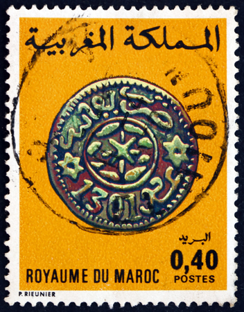 MOROCCO - CIRCA 1976: a stamp printed in Morocco shows Copper Coin, Fez, 1883-84, circa 1976のeditorial素材
