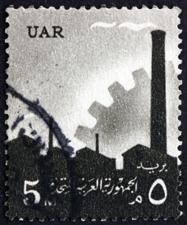 EGYPT - CIRCA 1960: a stamp printed in Egypt shows Factory and Cogwheel, Industry, circa 1960のeditorial素材