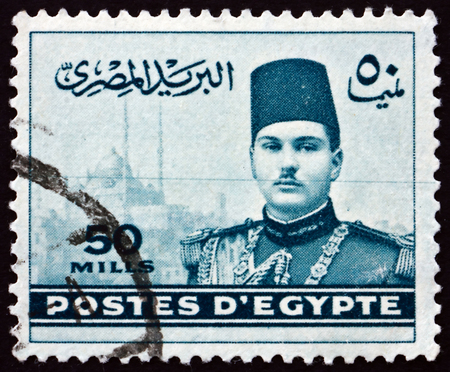 EGYPT - CIRCA 1939: a stamp printed in Egypt shows King Farouk and Cairo Citadel, circa 1939のeditorial素材