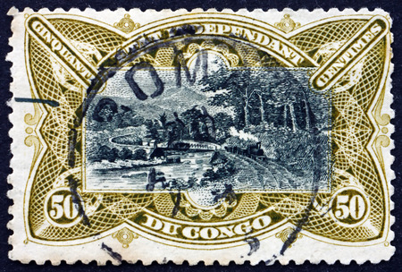 BELGIAN CONGO - CIRCA 1922: a stamp printed in Belgian Congo shows Railroad Bridge on M'pozo River, circa 1922のeditorial素材