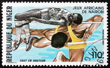 NIGER - CIRCA 1987: a stamp printed in Niger shows High Jump, African Games, Nairobi, circa 1987のeditorial素材