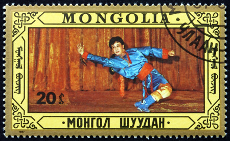 MONGOLIA - CIRCA 1987: a stamp printed in Mongolia shows Folk Dance, circa 1987のeditorial素材