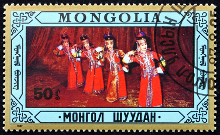 MONGOLIA - CIRCA 1987: a stamp printed in Mongolia shows Folk Dance, circa 1987のeditorial素材