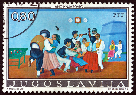 YUGOSLAVIA - CIRCA 1974: a stamp printed in Yugoslavia shows Children's Dance, Painting by Jano Knjazovic, circa 1974のeditorial素材