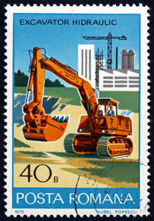 ROMANIA - CIRCA 1978: a stamp printed in Romania shows Hydraulic Excavator, Industrial Development, circa 1978のeditorial素材