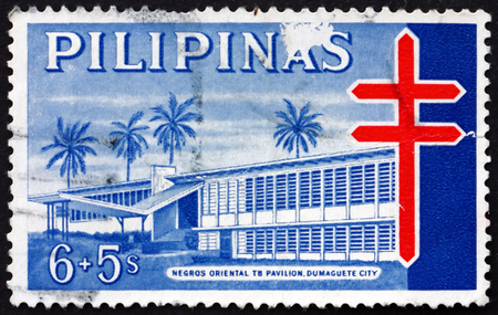 PHILIPPINES - CIRCA 1964: a stamp printed in Philippines shows Negros Oriental T.B. Pavilion, circa 1964のeditorial素材