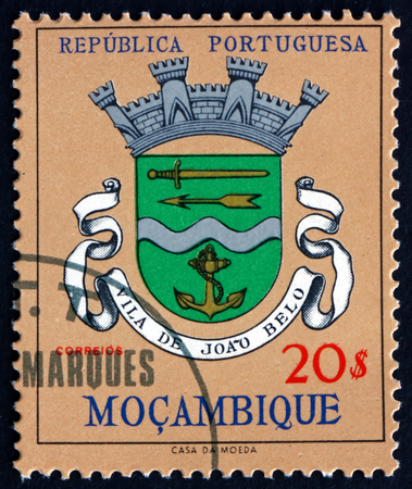 MOZAMBIQUE - CIRCA 1961: a stamp printed in Mozambique shows Vila de Joao Belo, city coat of arms, circa 1961のeditorial素材
