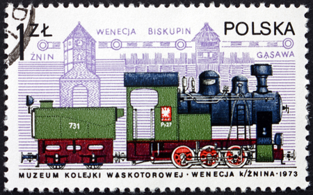 POLAND - CIRCA 1978: a stamp printed in the Poland shows narrow-gauge engine and gothic tower, Znin, circa 1978のeditorial素材