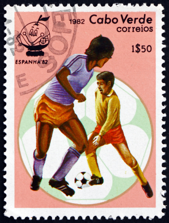 CAPE VERDE - CIRCA 1982: a stamp printed in the Cape Verde shows soccer players and ball, 1982 World Cup, circa 1982のeditorial素材