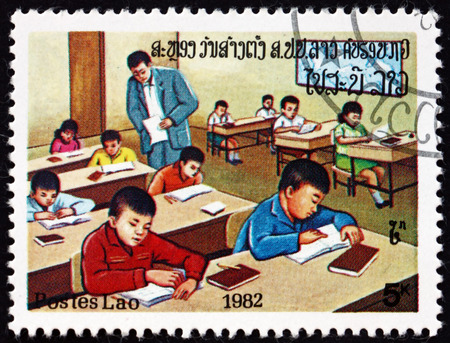 LAOS - CIRCA 1982: a stamp printed in Laos shows classroom, education, circa 1982のeditorial素材