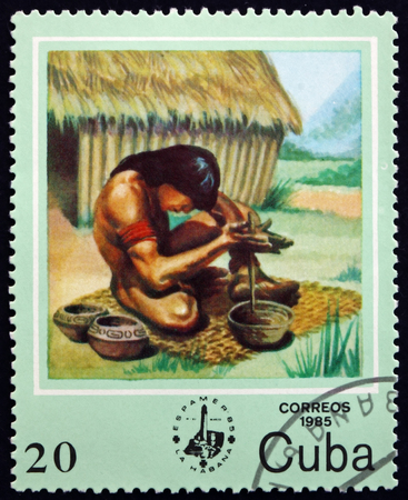 CUBA - CIRCA 1985: a stamp printed in the Cuba shows potter, Indian activity, circa 1985のeditorial素材
