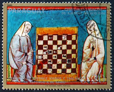 PARAGUAY - CIRCA 1980: a stamp printed in Paraguay shows Two Women and Chess Board, Illustration from the Book of Chess, 1980 World Chess Championships, Mexico, circa 1980のeditorial素材