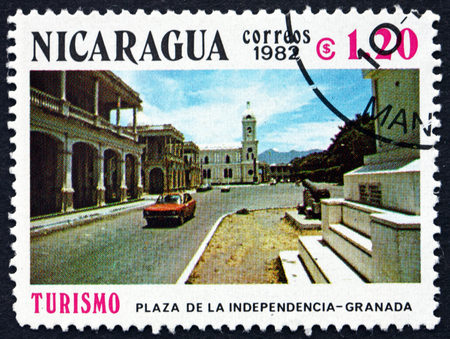 NICARAGUA - CIRCA 1982: a stamp printed in Nicaragua shows Independence Plaza, Granada, circa 1982のeditorial素材