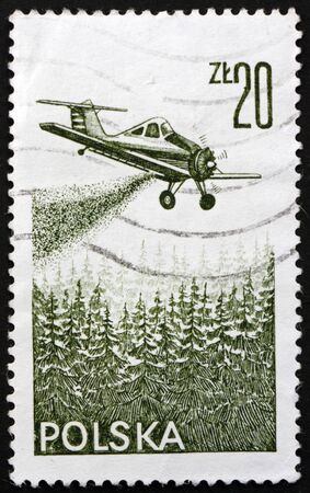 POLAND - CIRCA 1977: a stamp printed in Poland shows agricultural aircraft, PZL-106 Kruk (Raven), crop spraying plane, circa 1977のeditorial素材