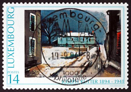 LUXEMBOURG - CIRCA 1994: a stamp printed in Luxembourg shows Snow-covered landscape, painting by Joseph Kutter, circa 1994のeditorial素材