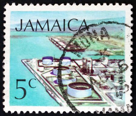 JAMAICA - CIRCA 1972: a stamp printed in Jamaica shows Oil refinery, technology, circa 1994のeditorial素材