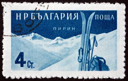 BULGARIA - CIRCA 1958: a stamp printed in Bulgaria shows Skis and Pirin mountains, Bulgarian health resort, circa 1958のeditorial素材