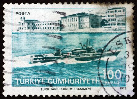 TURKEY - CIRCA 1973: a stamp printed in Turkey shows Speedboat Simsek and Naval College, circa 1973のeditorial素材