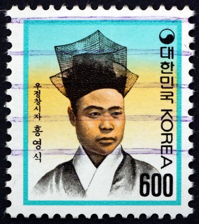 SOUTH KOREA - CIRCA 1990: a stamp printed in South Korea shows Hong Yong-Sik, first Postmaster General, circa 1990のeditorial素材