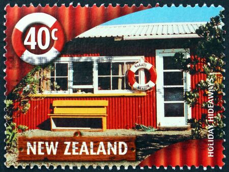 NEW ZEALAND - CIRCA 2002: a stamp printed in New Zealand shows vacation home with life preserver, circa 2002のeditorial素材