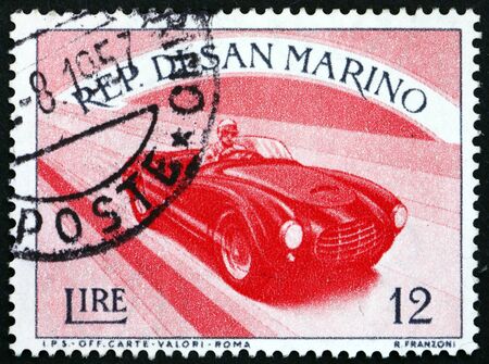 SAN MARINO - CIRCA 1954: a stamp printed in San Marino shows automobile, sport, circa 1954のeditorial素材