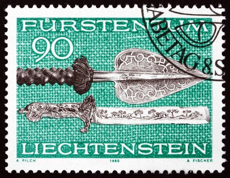 LIECHTENSTEIN - CIRCA 1980: a stamp printed in Liechtenstein shows Spear and Knife, circa 1980のeditorial素材
