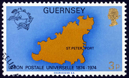 GUERNSEY - CIRCA 1974: a stamp printed in Guernsey shows map of Guernsey, UPU centenary, circa 1974のeditorial素材