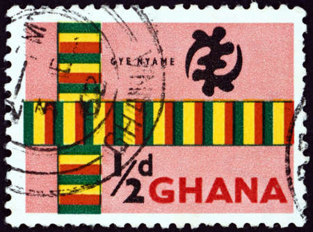 GHANA - CIRCA 1959: a stamp printed in Ghana shows Kente cloth and God's omnipotence symbol, circa 1959の写真素材