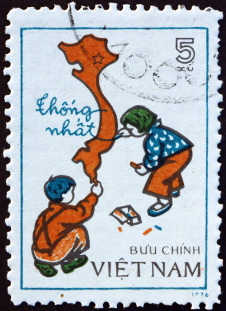 VIETNAM - CIRCA 1977: a stamp printed in Vietnam shows children drawing map of unified Viet Nam, circa 1977の写真素材