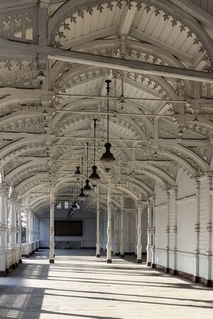 The Colonnade is covered by the gabled roof and it is surrounded by wooden walls on three sides. The front wall consists of the pillared arcade.のeditorial素材