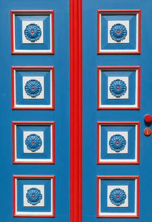 decorative blue door with an ornamentの写真素材
