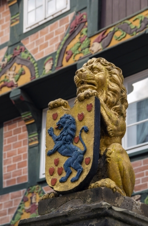 figure of a lion with the coat of arms on the street in the city Celle, Germanyの写真素材